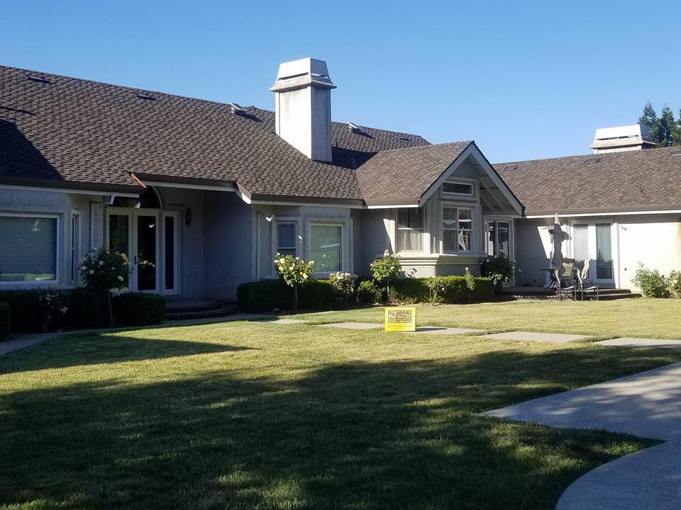 Completed NuShake Roofing shingle roof on a Livermore, CA ranch home, yard sign in lawn