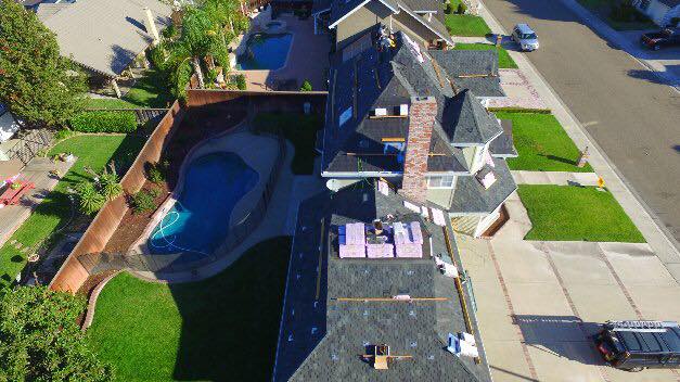 Aerial view of a NuShake Roofing shingle replacement on a Ripon, CA home, truck at curb