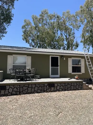 NuShake Roofing job in progress on a single-story Central Valley home, ladder set for roof access