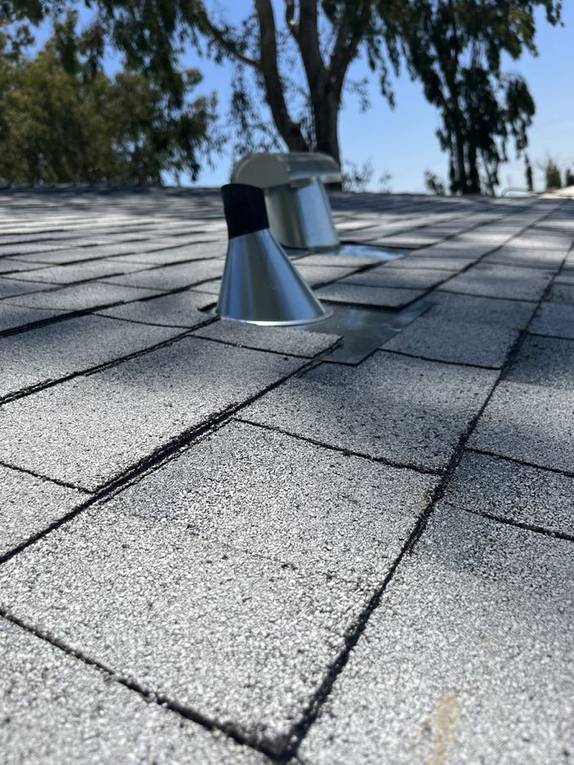 New vent-pipe boot and flashing installed on a shingle roof by NuShake Roofing