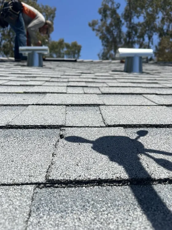 Roof vents set on a completed shingle roof by NuShake Roofing