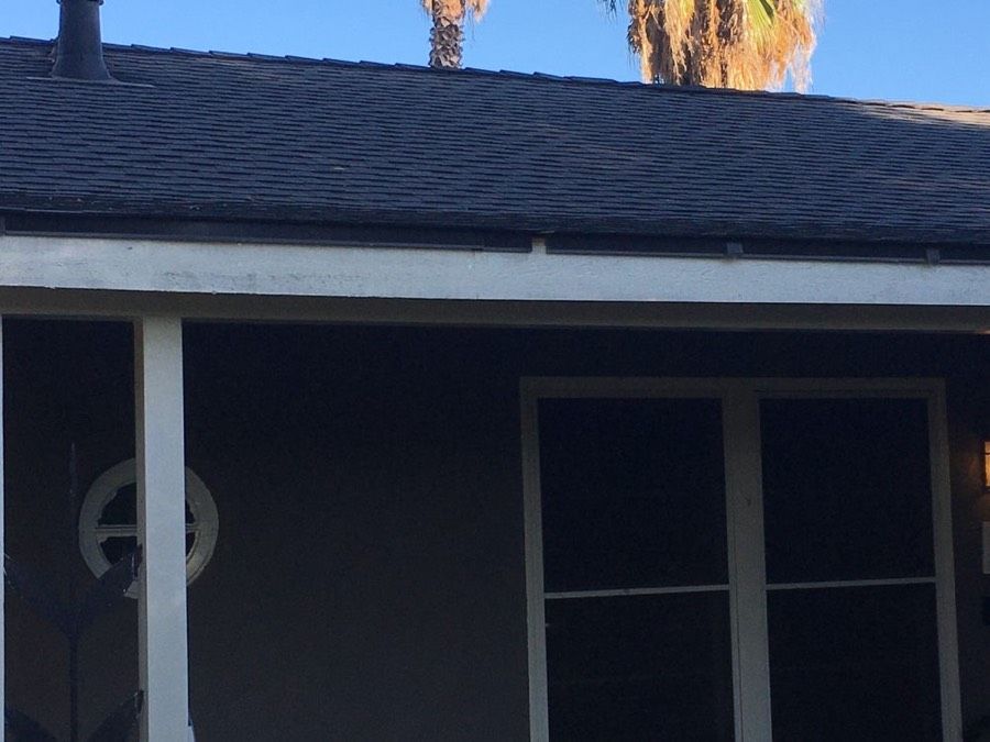 Eave, fascia, and flashing detail on a completed NuShake Roofing project